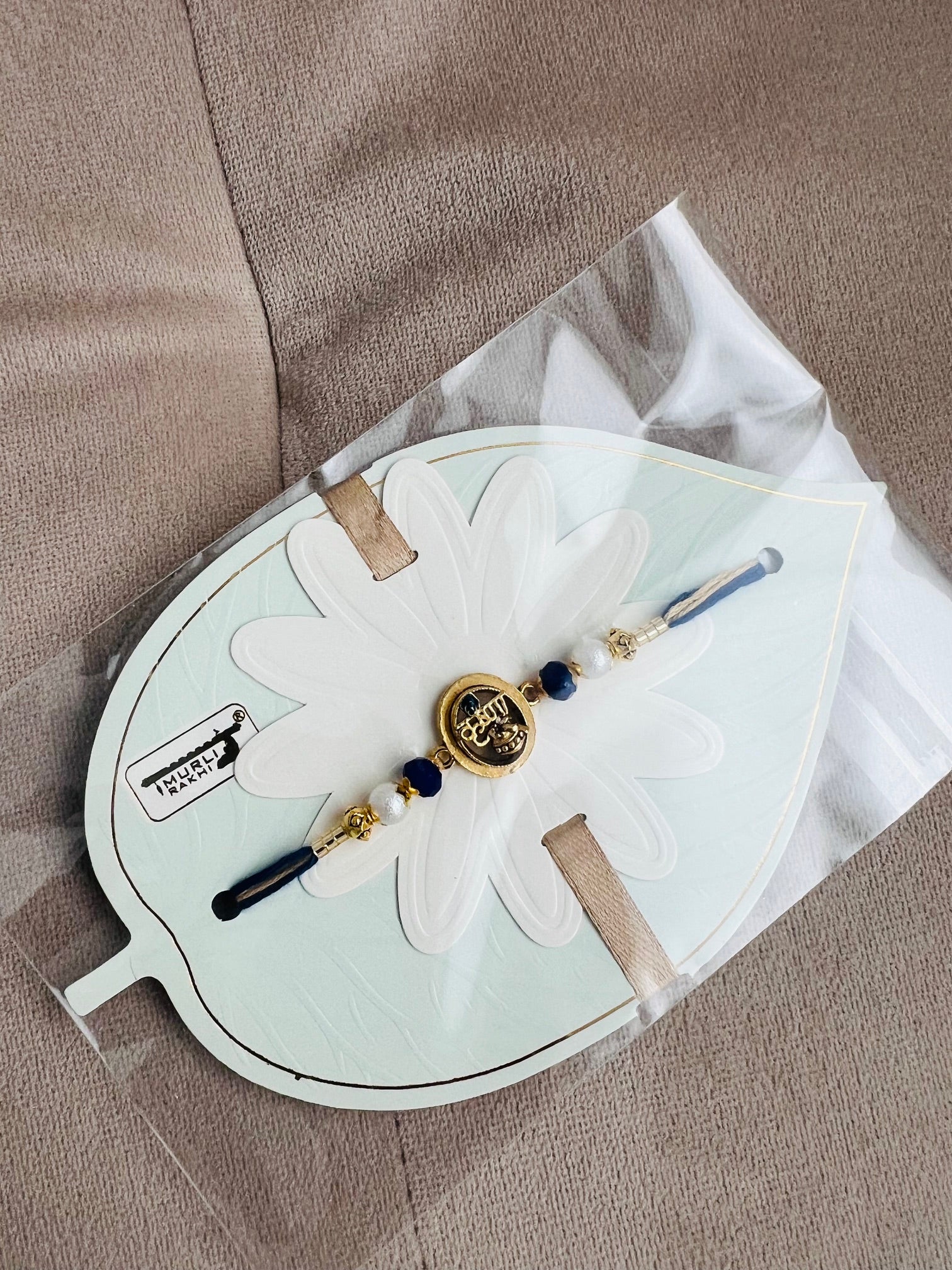 Krishna Rakhi – Elegant Leaf Card Edition