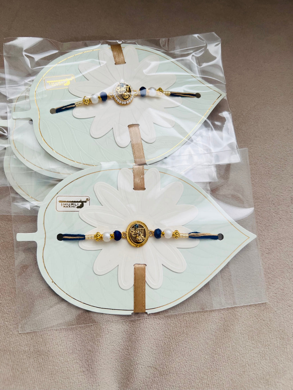 Krishna Rakhi – Elegant Leaf Card Edition