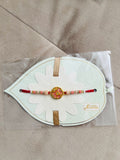 Designer Floral Rakhi – Pink Stone Centerpiece, Gold Beads & Premium Packaging
