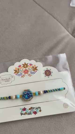 Designer Peacock Rakhi – Blue & Gold Pendant, Premium Beads